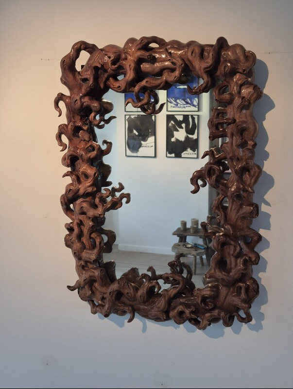 Mirror (size 50x70) surrounded by a frame in mangrove root. 