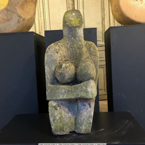 large stone sculpture featuring a woman , great weathered patina for sell